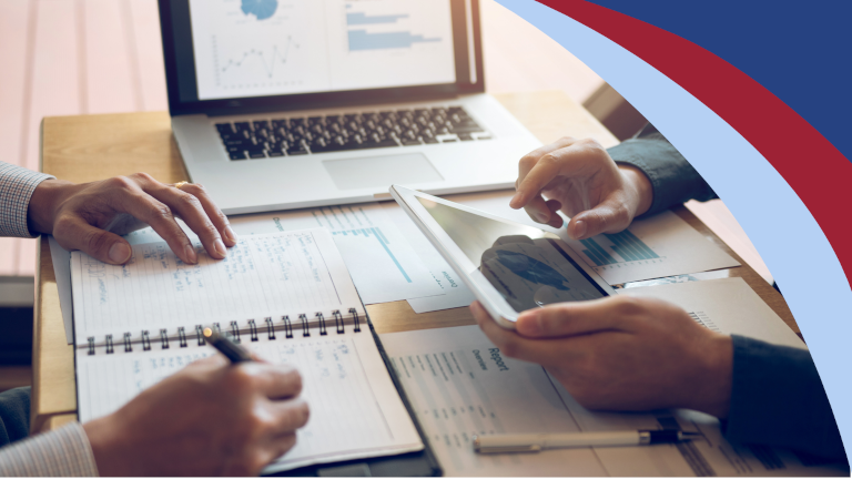 Two people reviewing a financial report