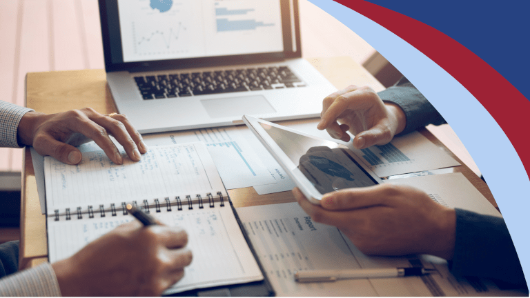 Two people reviewing a financial report