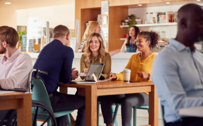 A group of coworkers meeting in the office cafe