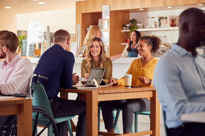 A group of coworkers meeting in the office cafe