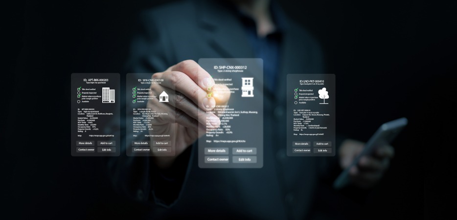 A manager reviewing information about multiple real estate properties